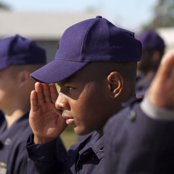 Cadet saluting outside
